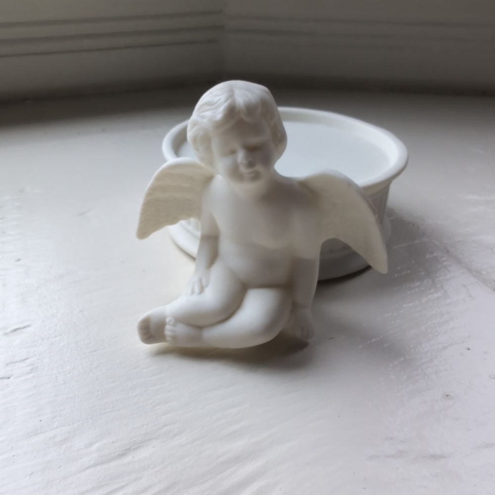 White porcelain or bisque cherub angel candle holder decorative figure